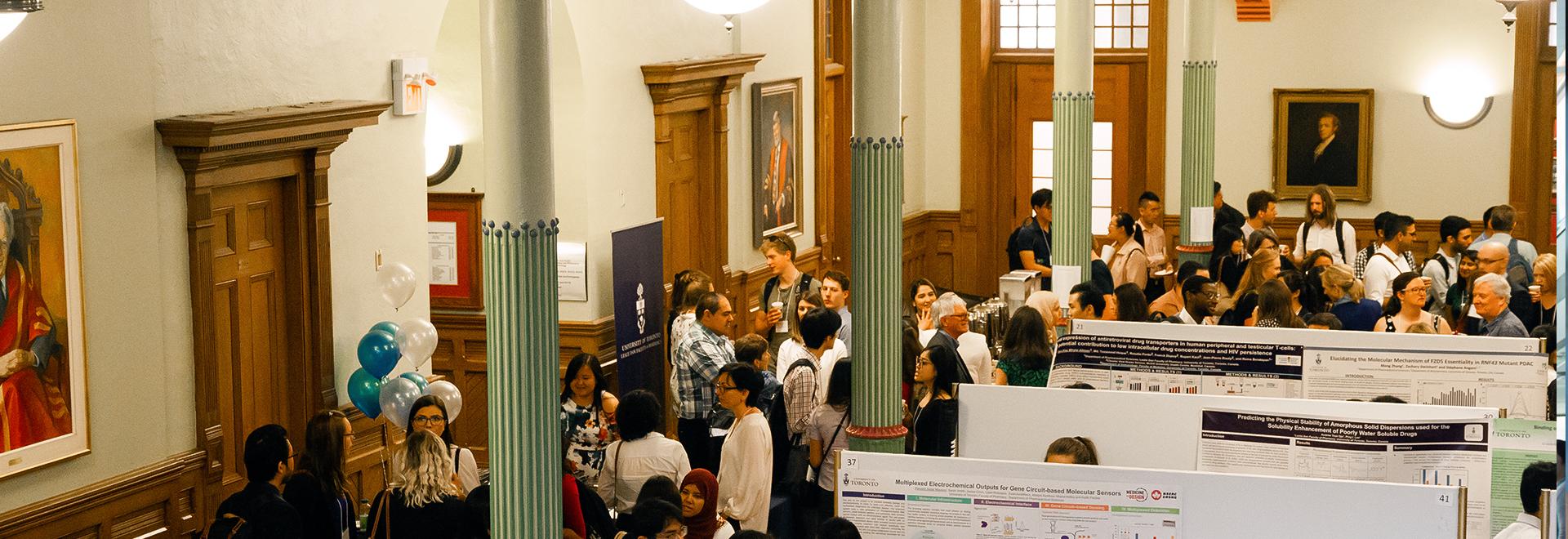 Graduate Research in Progress Symposium Overhead photo of attendees at Graduate Research in Progress Symposium