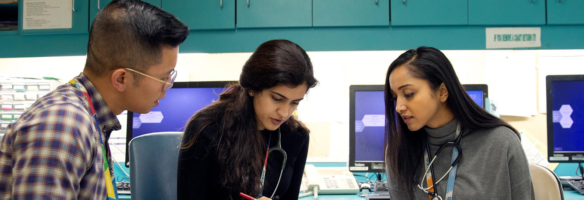 Pharmacy Residencies Banner Pharmacists in discussion at the Hospital for Sick Children