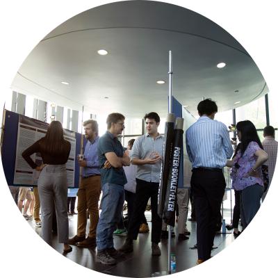 Photo of students and researchers at a poster session at the Leslie Dan Faculty of Pharmacy