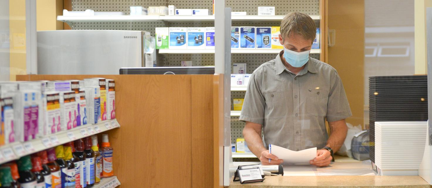 Mike Colebrook working at his Coldwater, Ontario pharmacy