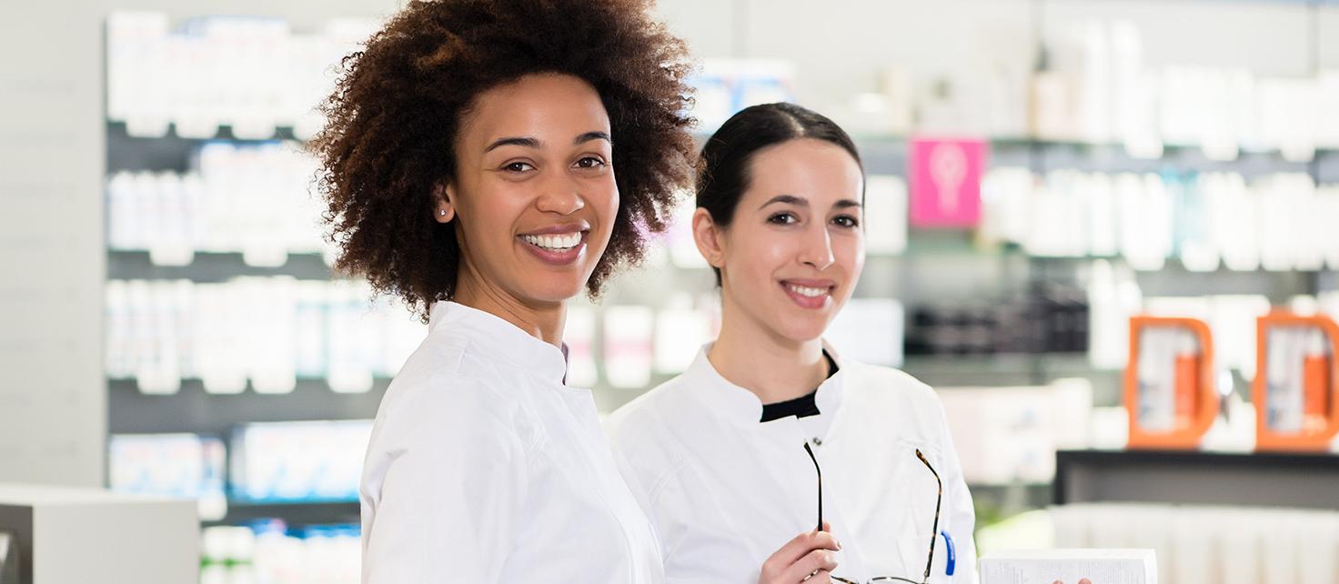 Two Pharmacists smiling at camera