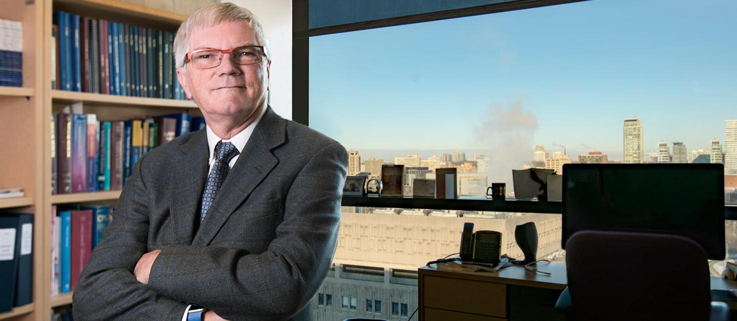 Portrait of Professor Raymond Reilly sitting in his office at the Leslie Dan Faculty of Pharmacy