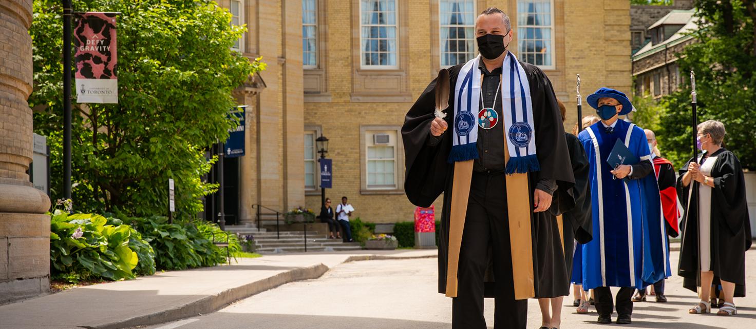 Assistant Prof Jaris Swidrovich leading the 2022 Pharmacy Convocation procession