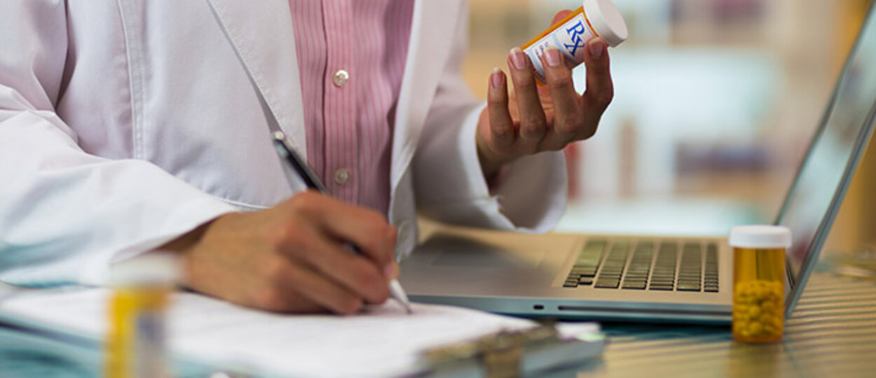 Pharmacist looking at medications