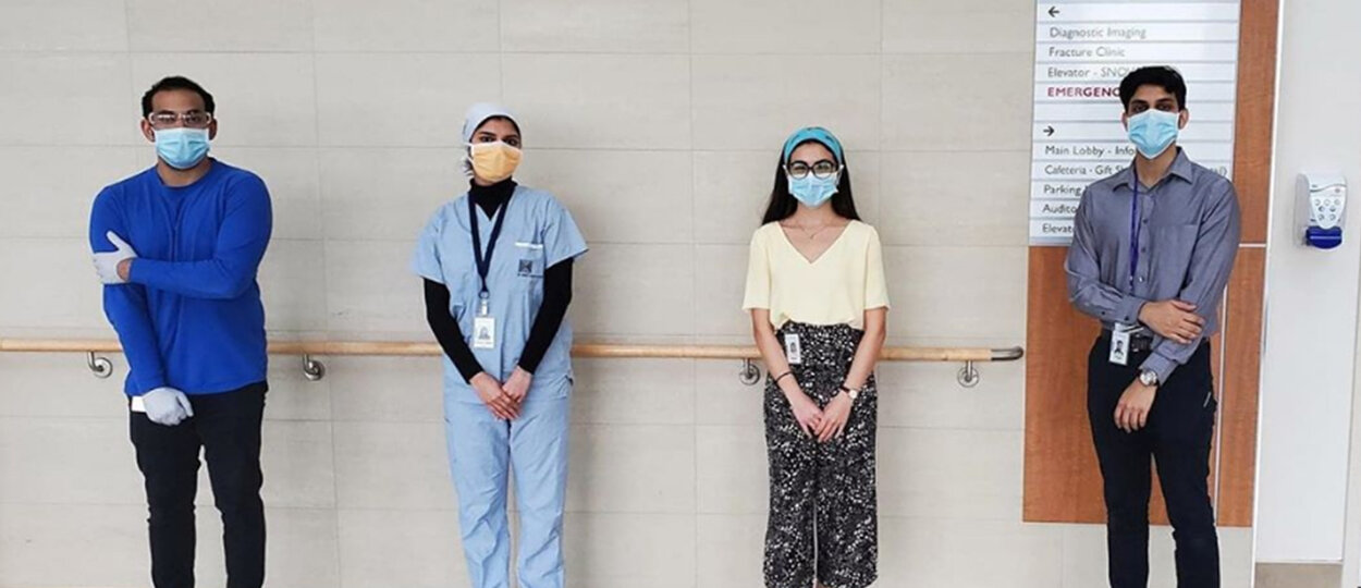 #PharmacistsOnTheFrontline Student Submission Four pharmacists standing six feet apart