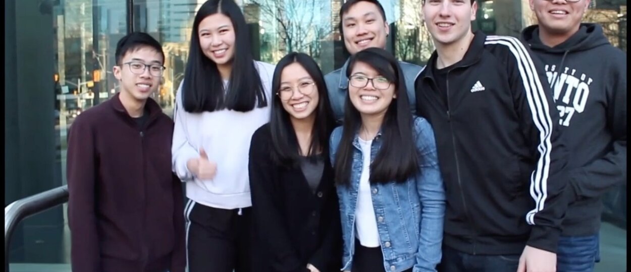 group of students gathered outside the Pharmacy building on U of T campus