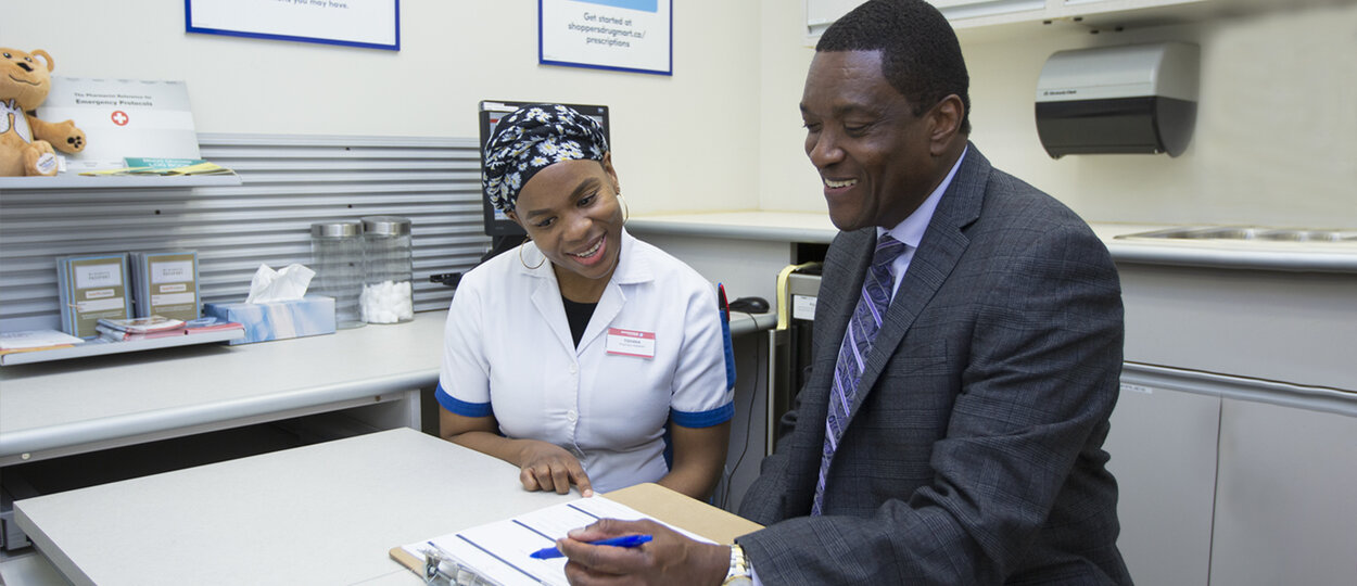 Pharmacist Ian Stewart with Pharmacy Technician Tishana Nelson-Erwin