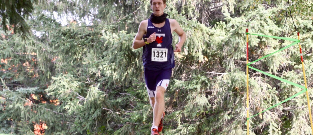 PharmD student Sam Kinahan running cross country race