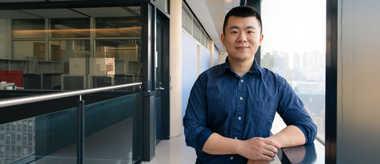 Professor Bowen Li standing in front of his lab