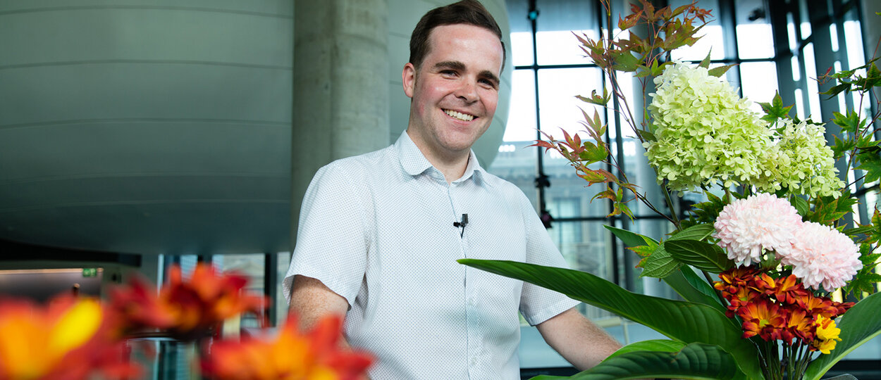 Portrait of PharmD student Mackenzie Richardson surrounded by flowers