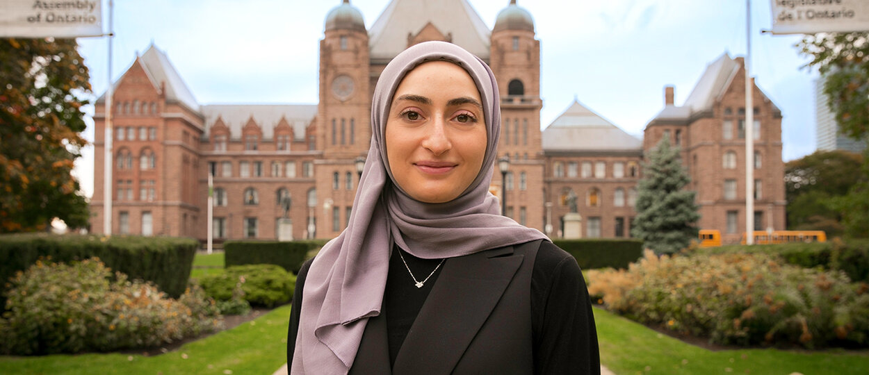 Portrait of Fourth Year PharmD Student Tahani Dakak standing in front of Queen's Park