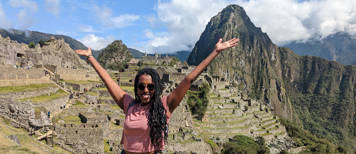 Photo of hospital pharmacist Erita Habtom in front of Machu Pichu