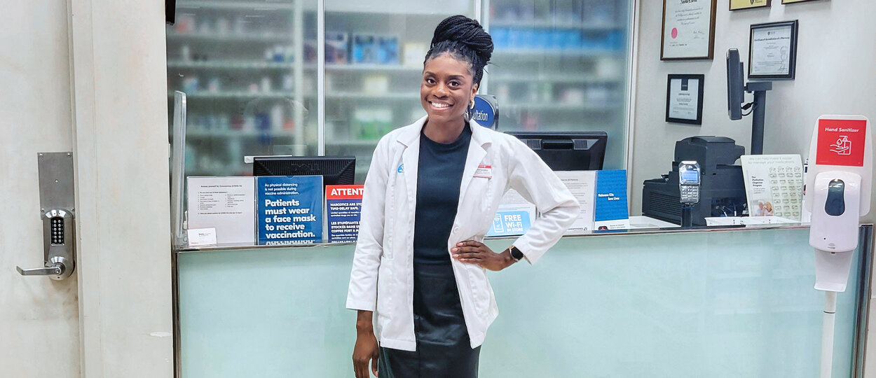 Pharmacist Nneke Ezurike in front of pharmacy counter