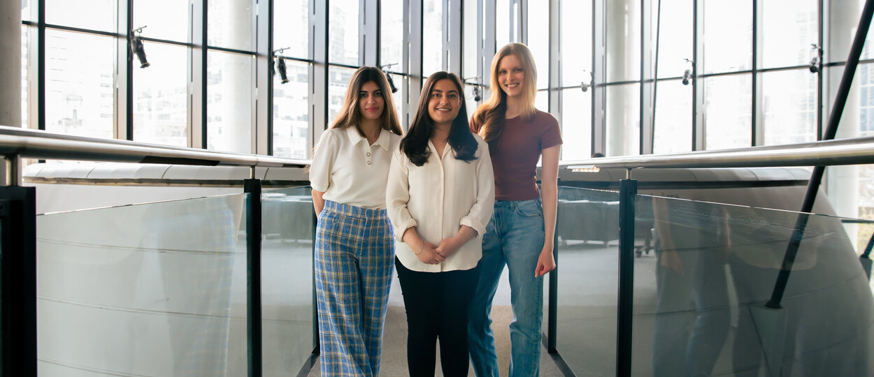 PharmD students Nursan Abdullah, Harneet Gill and Nina Seuntjens photographed inside Leslie Dan Faculty of Pharmacy Building