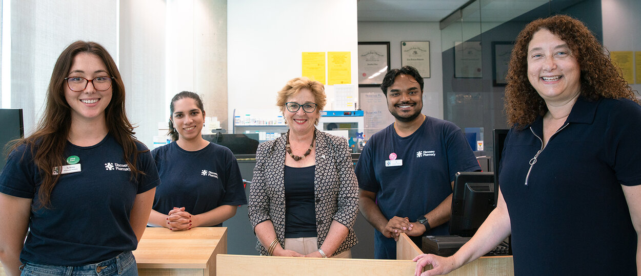 Ontario MPP and Parliamentary Assistant to the Minister of Health Robin Martin (center) met with students, faculty, and staff at U of T's Discovery Pharmacy.