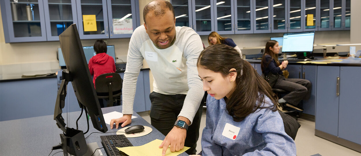 Instructor leading student during PharmPath event