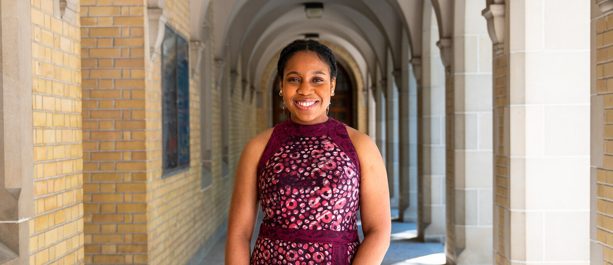 Portrait of 2T4 PharmD Gradauate Theodora Udounwa photographed in the outside courtyard of University College