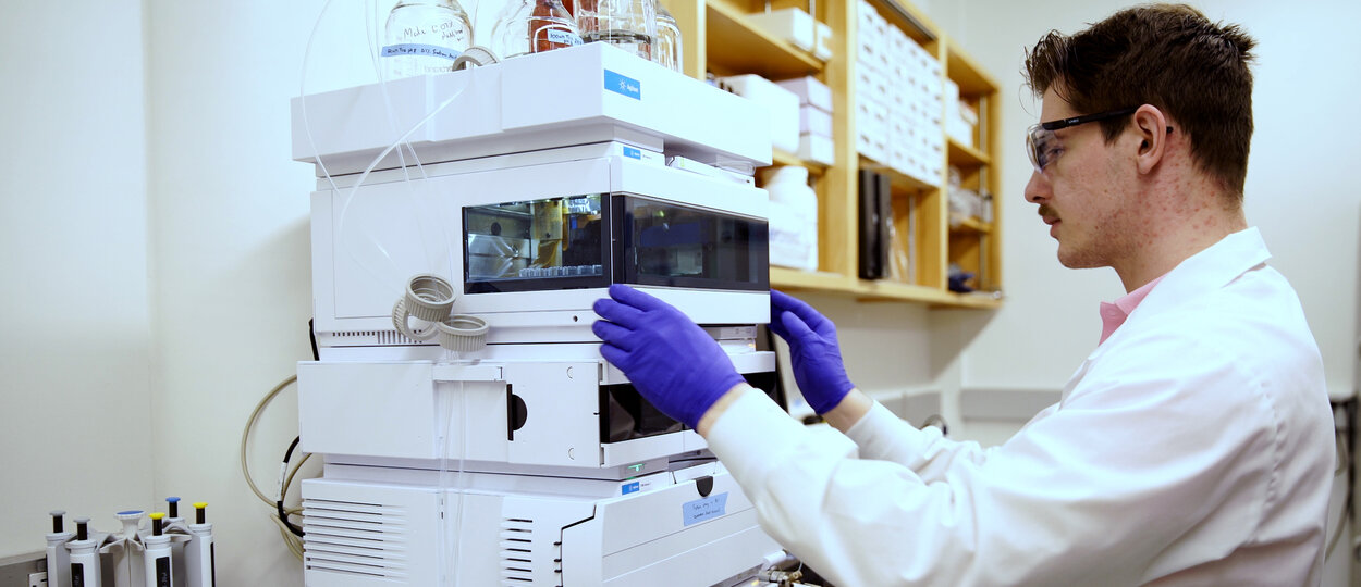 Li lab member working with lab equipment