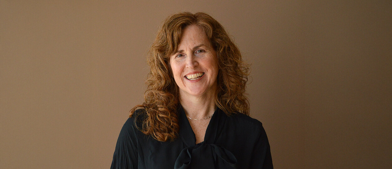 Portrait of Lisa Ferrara with muted background