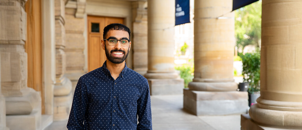 2T5 PharmD Valedictorian Ashish Gante pictured with convocation hall in background