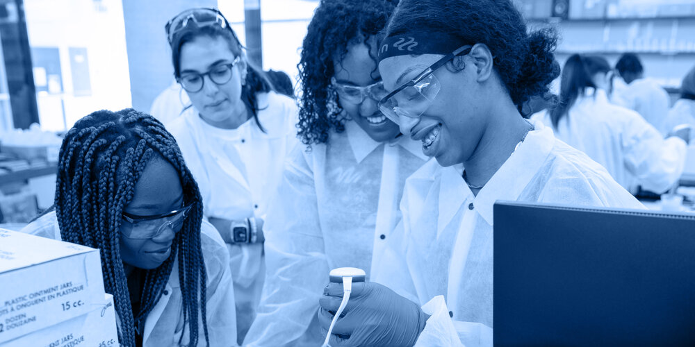 Three students working in the compounding lab