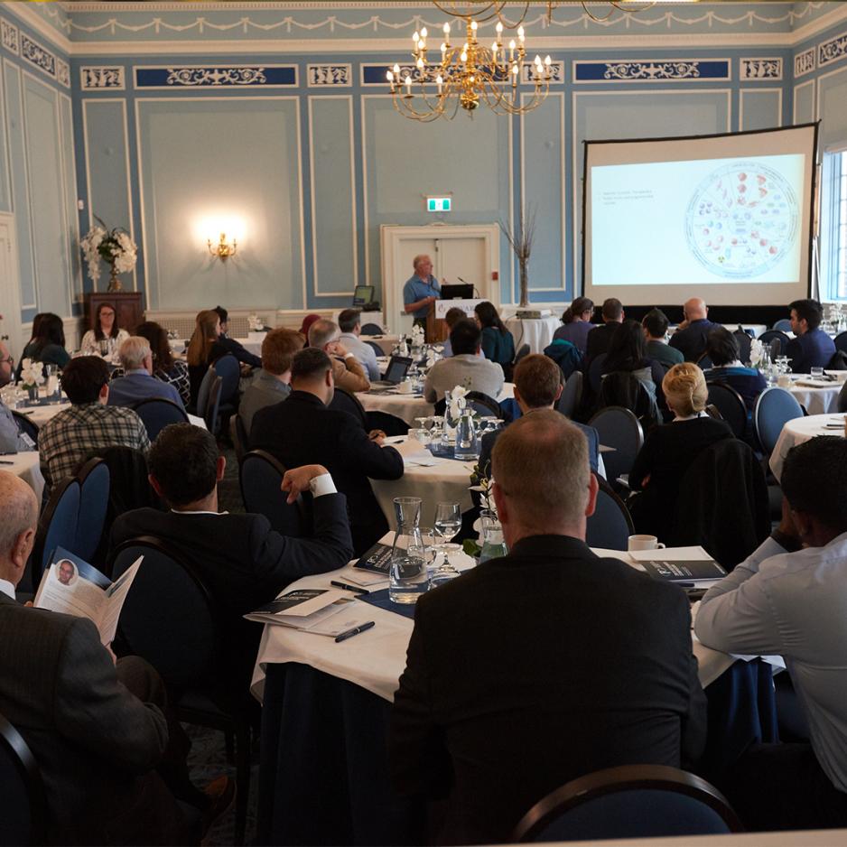 Photo of audience listening to keynote at the Centre for Pharmaceutical Oncology Symposium