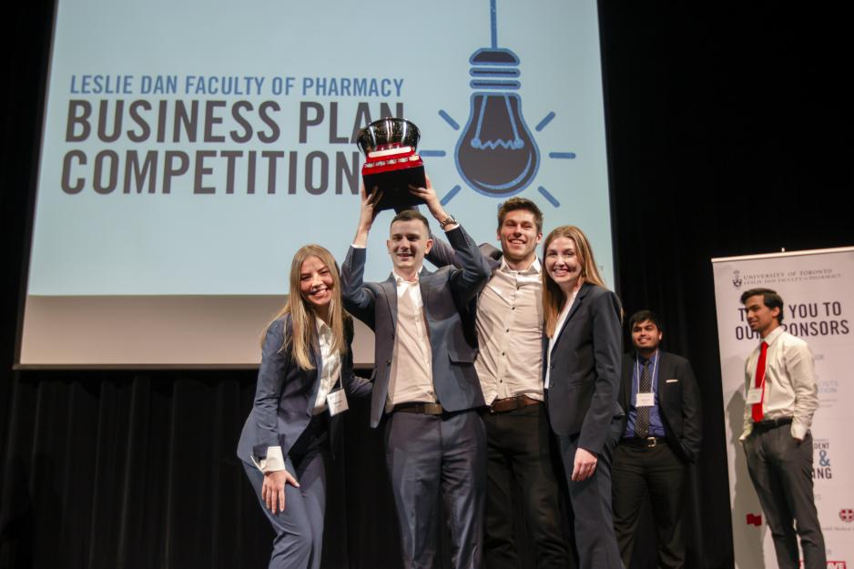 Team PharmDx won the 2019 Business Plan Competition and celebrates on stage