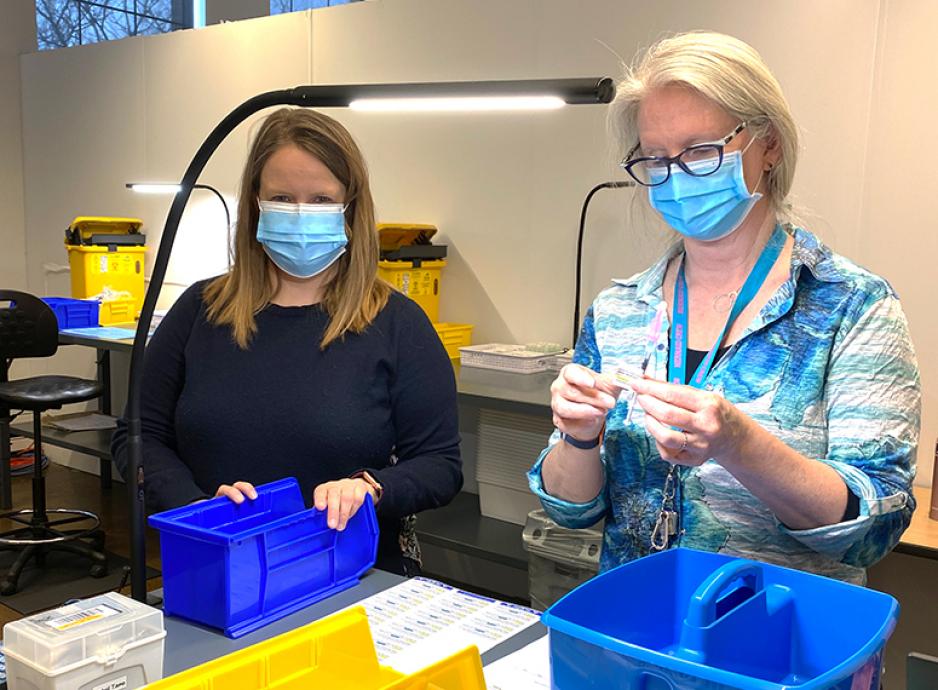 Assistant Professors Natalie Crown and Linda Dresser working in U of T Vaccine Clinic