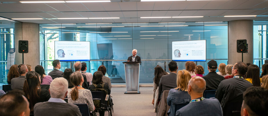 Professor Raymond Reilly giving a presentation to a crowd