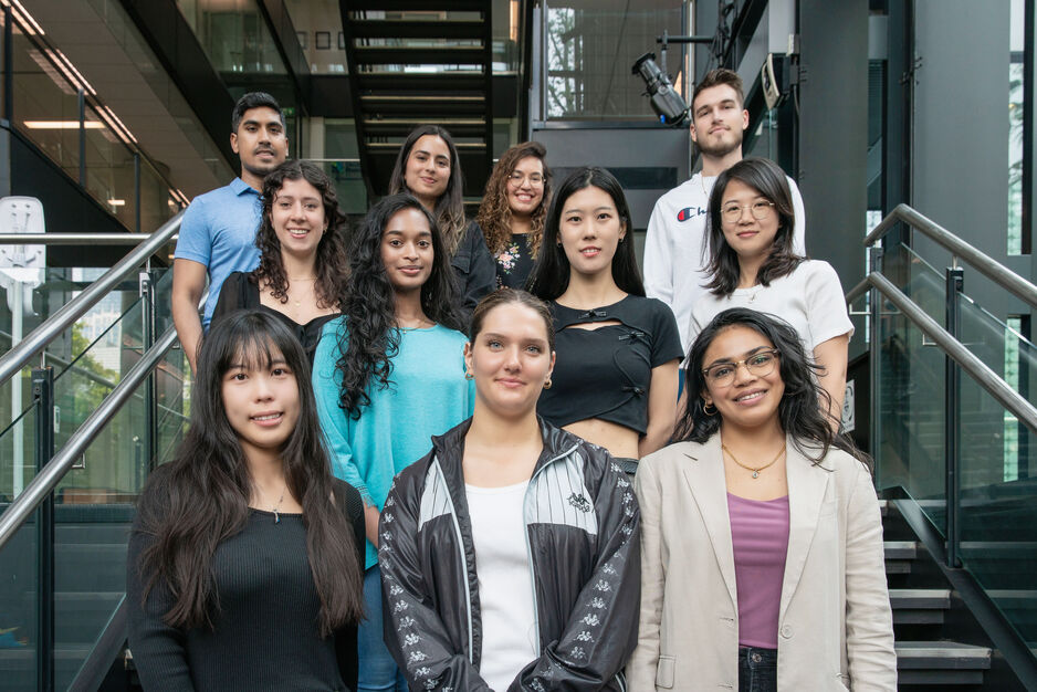 2023 Grip Organizing Committee standing inside Leslie Dan Faculty of Pharmacy Building