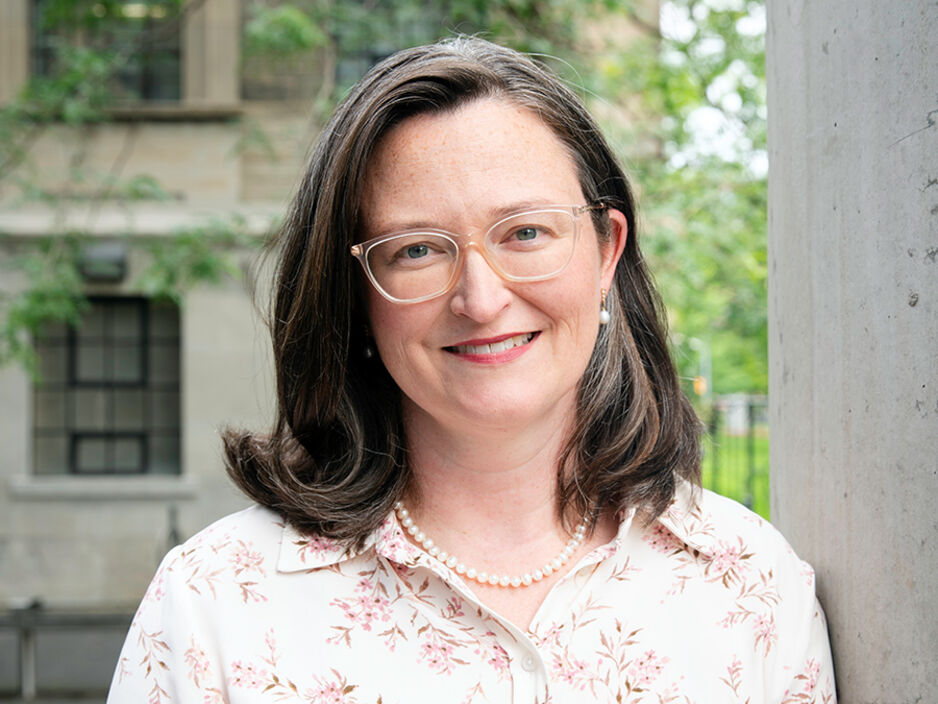 Portrait of Professor Carolyn Cummins outside of Leslie Dan Faculty of Pharmacy Building