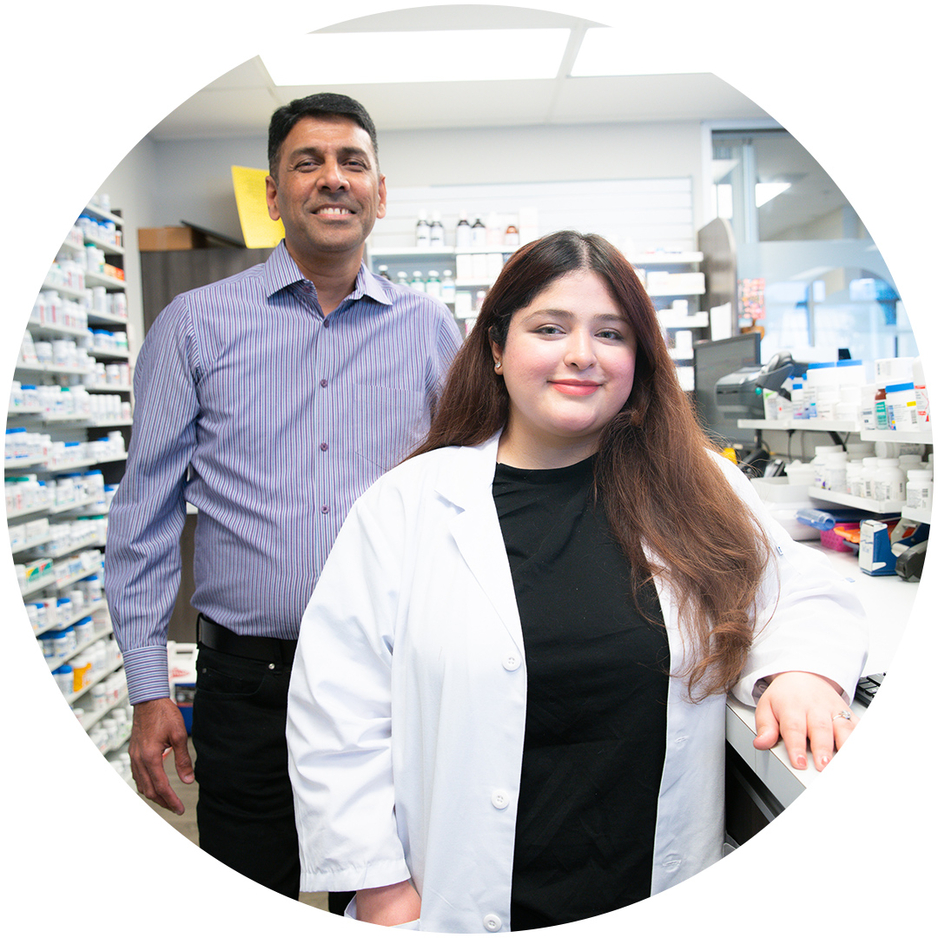 Fourth year PharmD student standing in pharmacy with preceptor