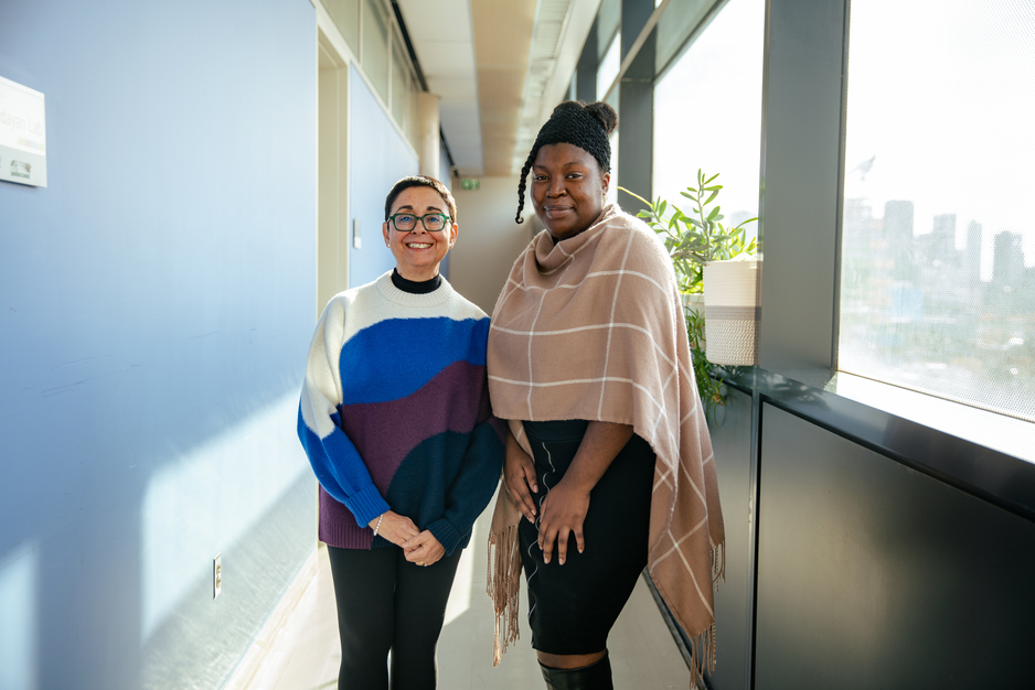 Professor Reina Bendayan and Pharmaceutical Sciences Masters student Teresa Bennett in hallway outside of Bendayan Lab
