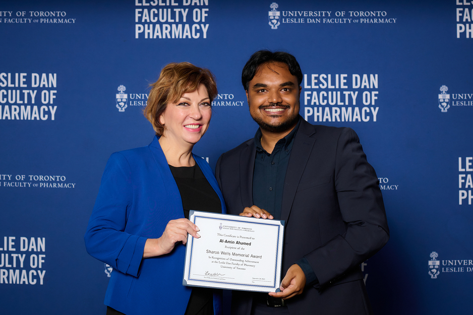 Interim Dean Micheline Piquette-Miller presenting the Sharon Wells Memorial Award to Al-Amin Ahamed, fourth year PharmD student