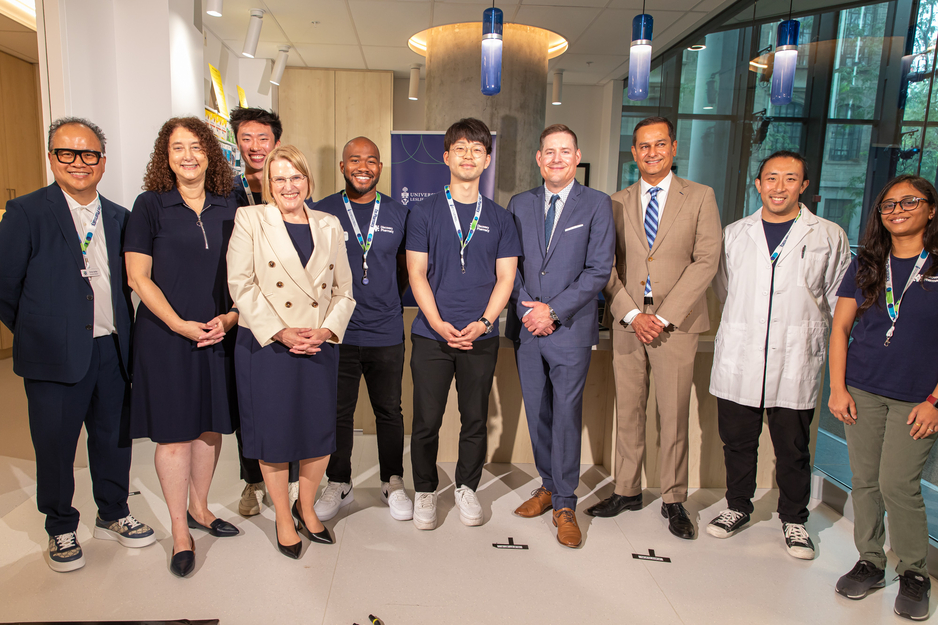 Honourable Syliva Jones photographed in Discovery Pharmacy with Dean Lisa Dolovich, Justin Bates and students