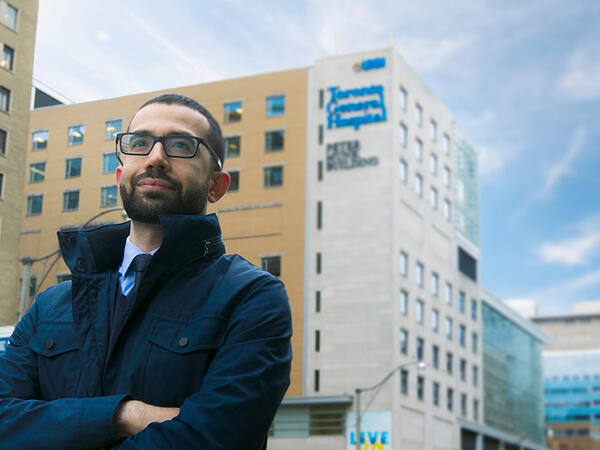 PharmD for Pharmacists Alumni Al-Harith Mohammad Portrait of PharmD for Pharmacists alumni Al-Harith Mohammad with UHN in the background