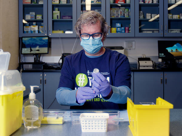 Photo of Tom Brown drawing vaccine doses Photo of Tom Brown drawing vaccine doses