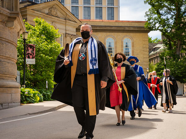 Assistant Prof Jaris Swidrovich leading the 2022 Pharmacy Convocation procession