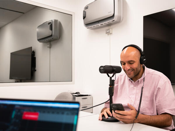 Assistant Professor Mina Tadrous recording a podcast