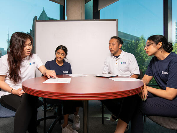 Members of the Discovery Pharmacy team sitting around table