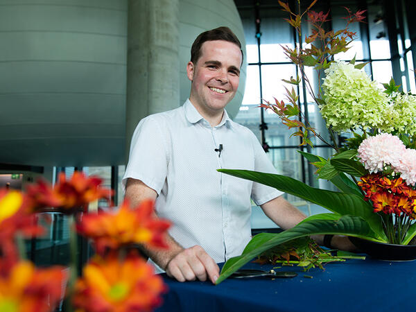 Portrait of PharmD student Mackenzie Richardson surrounded by flowers