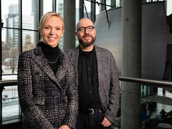 Christine Allen and Alan Aspuru-Guzik in the atrium of the Leslie Dan Faculty of Pharmacy