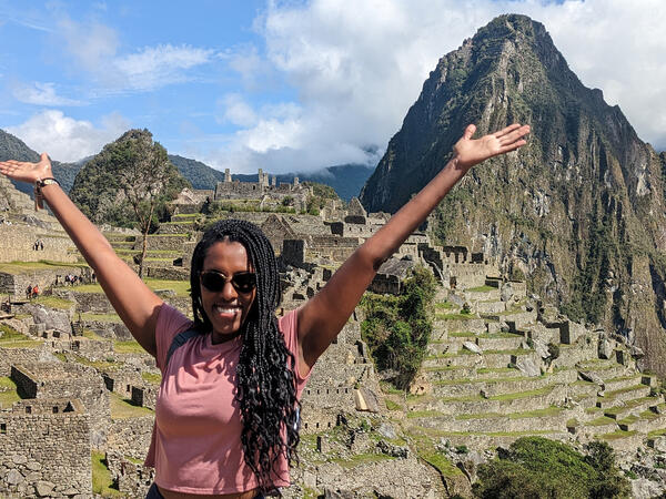 Photo of hospital pharmacist Erita Habtom in front of Machu Pichu