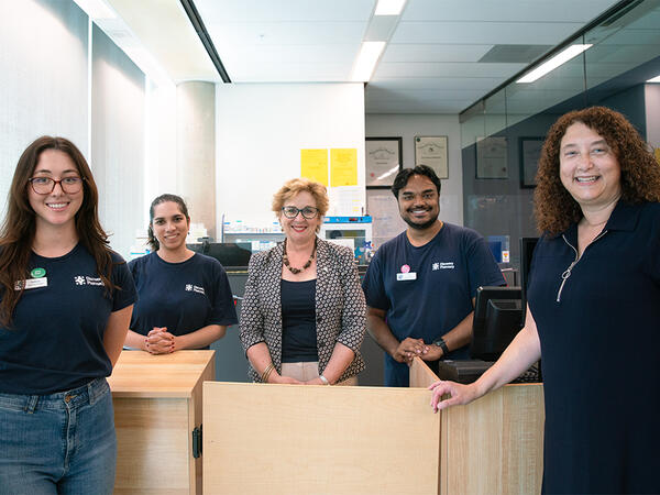 Ontario MPP and Parliamentary Assistant to the Minister of Health Robin Martin (center) met with students, faculty, and staff at U of T's Discovery Pharmacy.