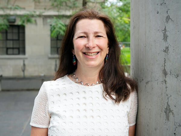 Portrait of University Professor Molly Shoichet outside of Leslie Dan Faculty of Pharmacy Building