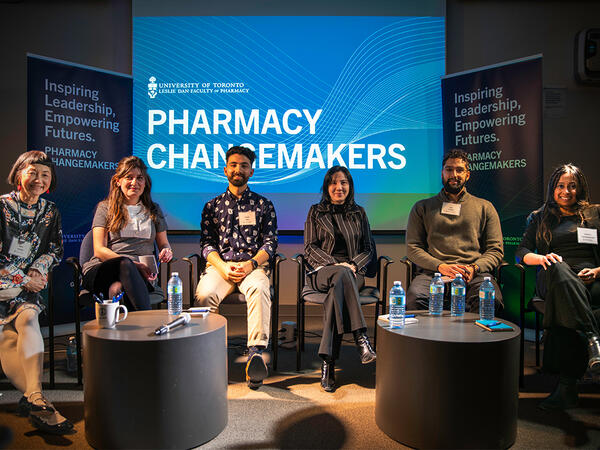 Alumni panelist sitting in front of Pharmacy Changemakers logo