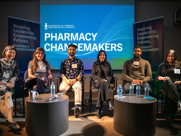 Alumni panelist sitting in front of Pharmacy Changemakers logo