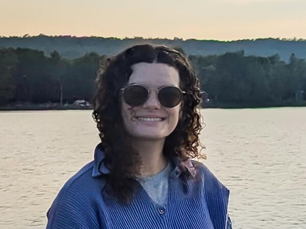 Portrait of PharmD student Alina Montgomery with lake in background at sunset