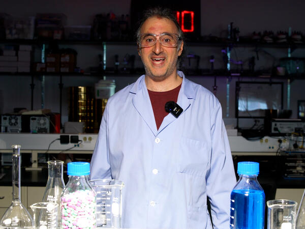 Professor Dubins standing in pharmaceutics lab