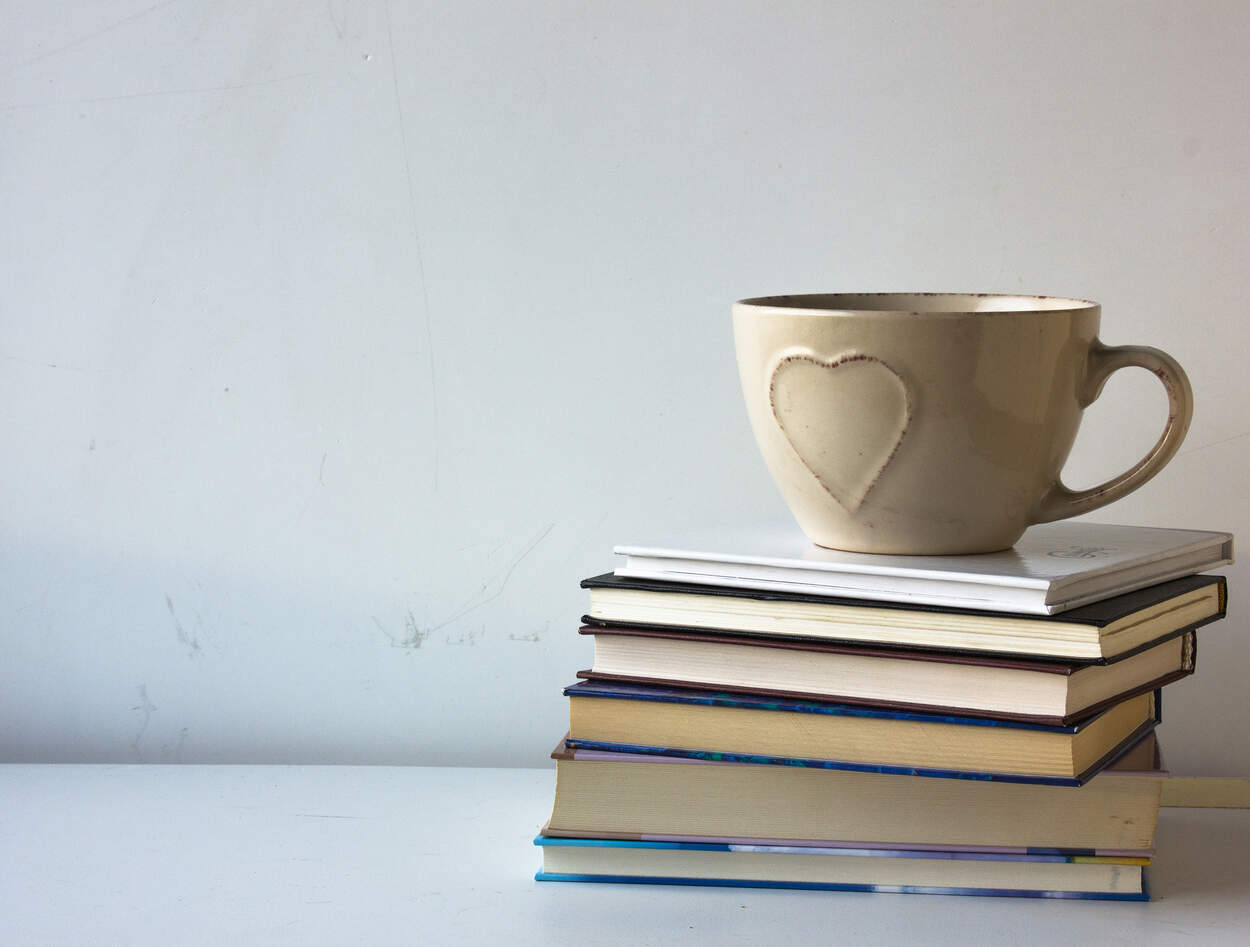 Books with a coffee mug